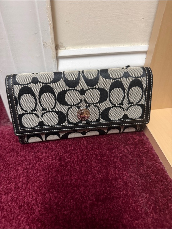 Coach Handbags - Coach Black and Cream Signature Foldover Wallet